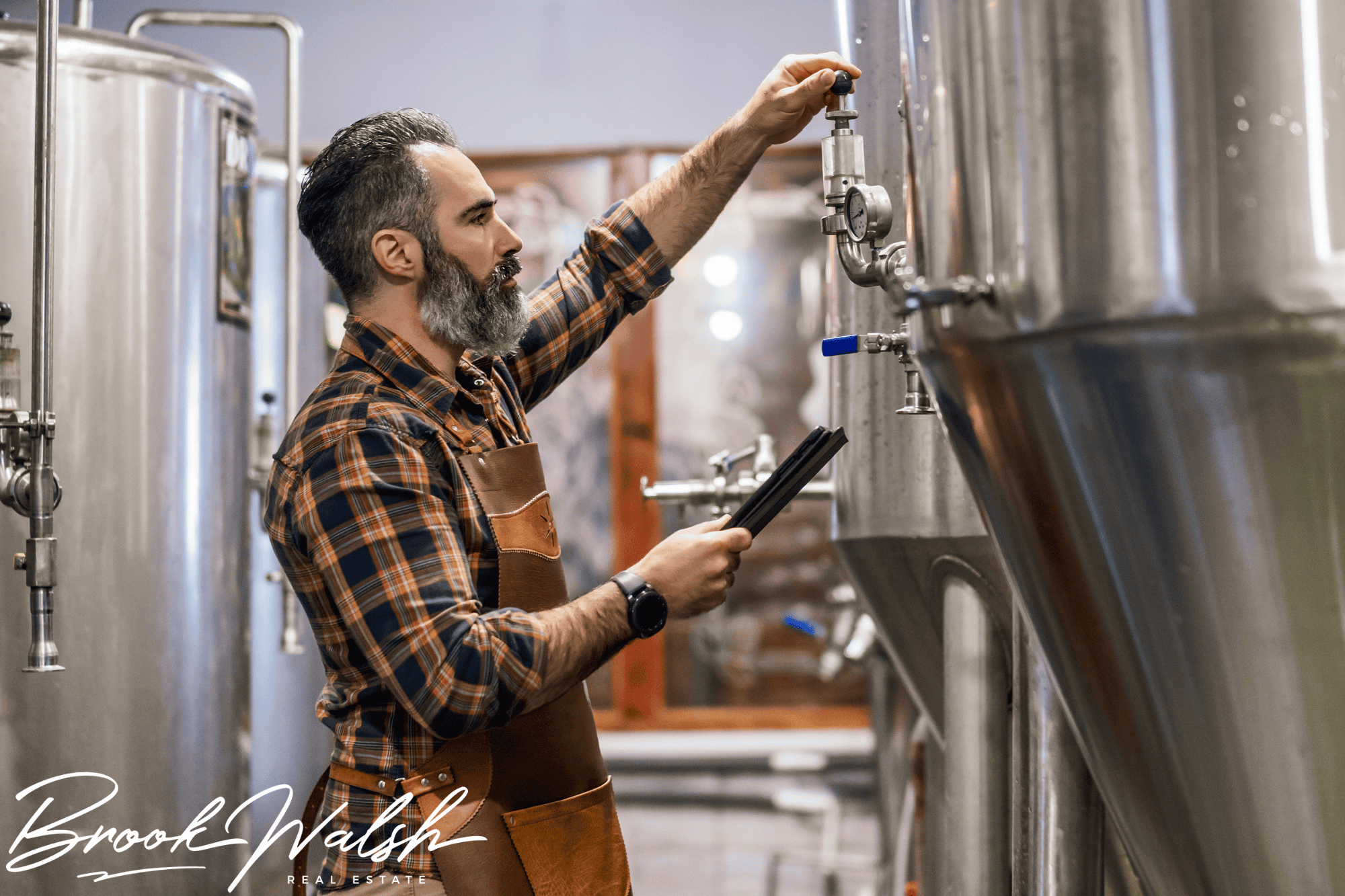 A group enjoying craft beers at an outdoor Petoskey brewery with scenic views