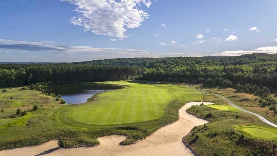 Scenic view of The Highlands at Harbor Springs with hiking trails and autumn foliage.
