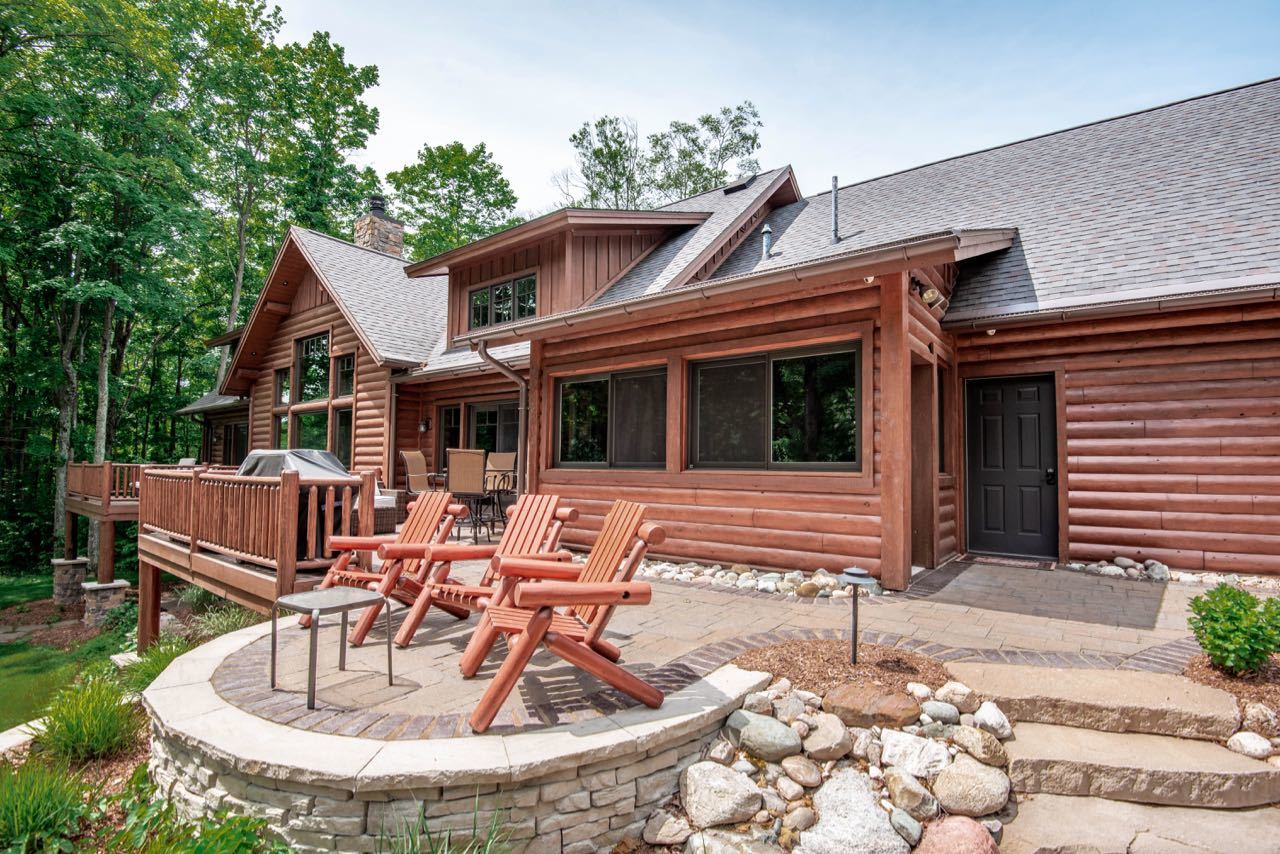 Aerial view of Mountain Club luxury homes overlooking ski slopes and forested hills at Boyne Mountain Resort