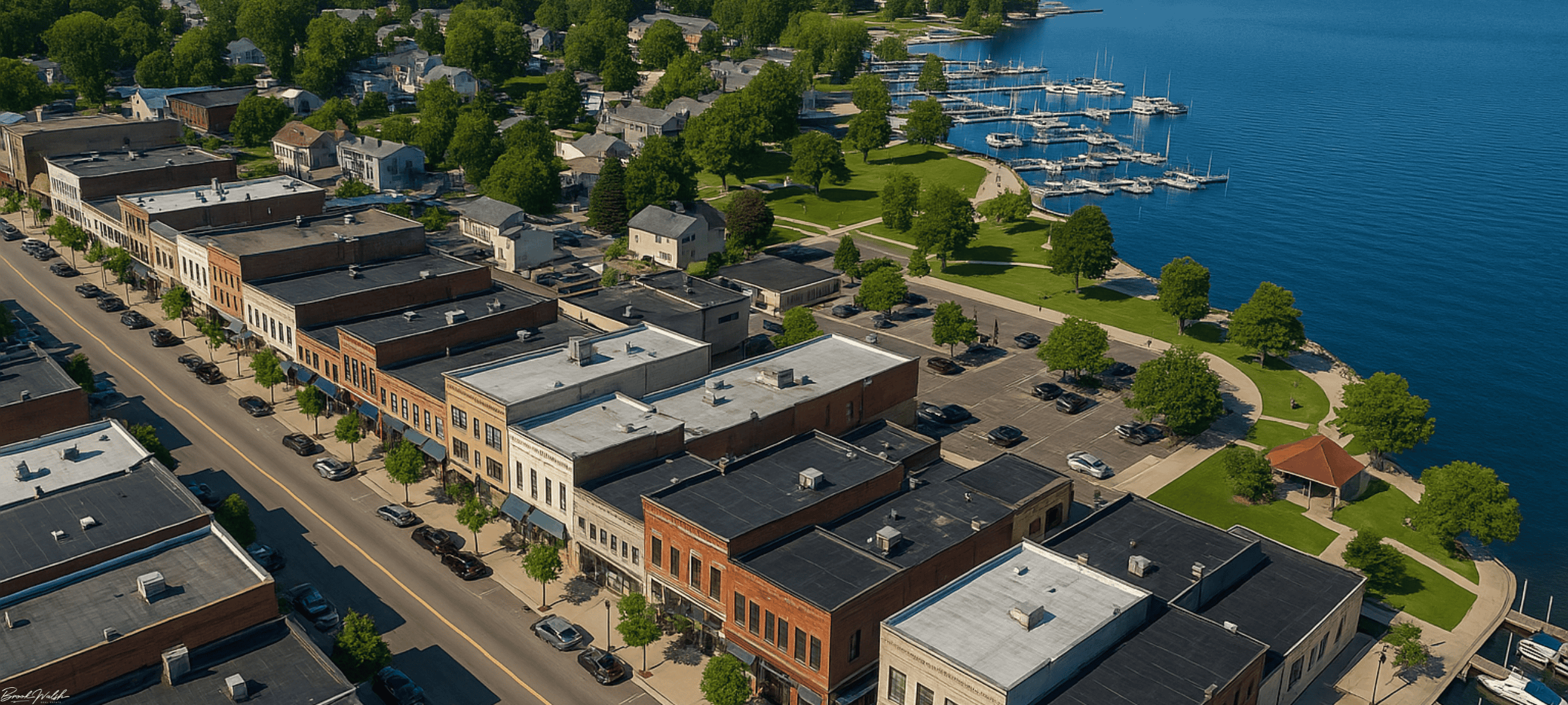 Aerial view of commercial buildings and waterfront district in Boyne City, Michigan.