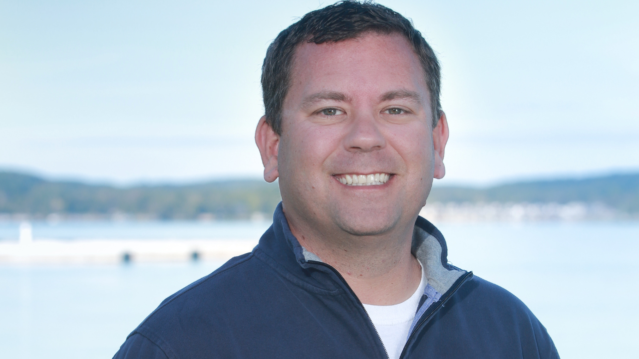 A professional headshot of Brook Walsh, a top-rated realtor with over a decade of experience in the Lake Charlevoix real estate market.