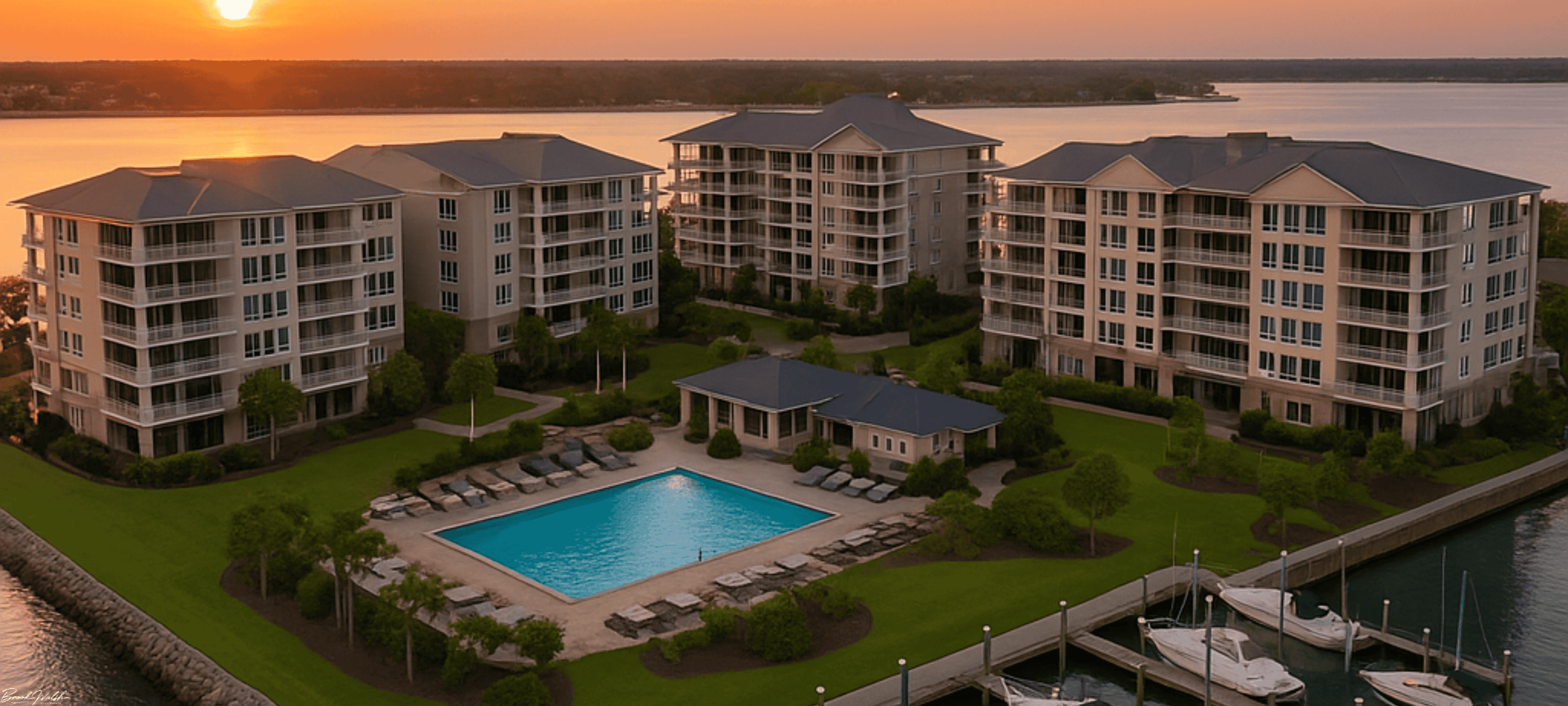 Aerial view of Lake Charlevoix with luxury condominium buildings lining the shoreline