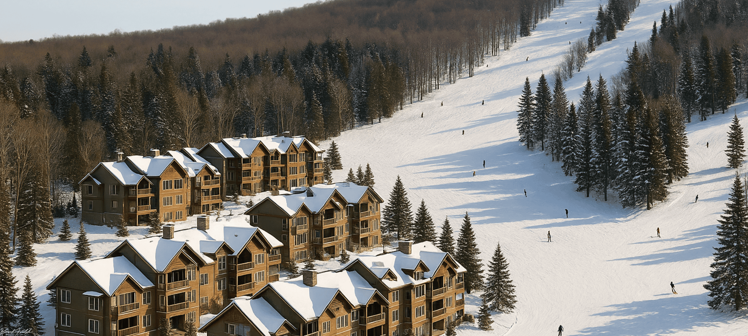 Aerial view of Disciples Ridge condos at Boyne Mountain Resort with ski slopes and surrounding forest
