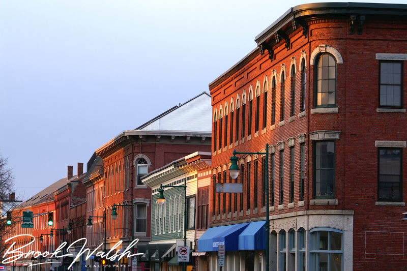 A vibrant street in Downtown Gaylord, surrounded by trees and storefronts.