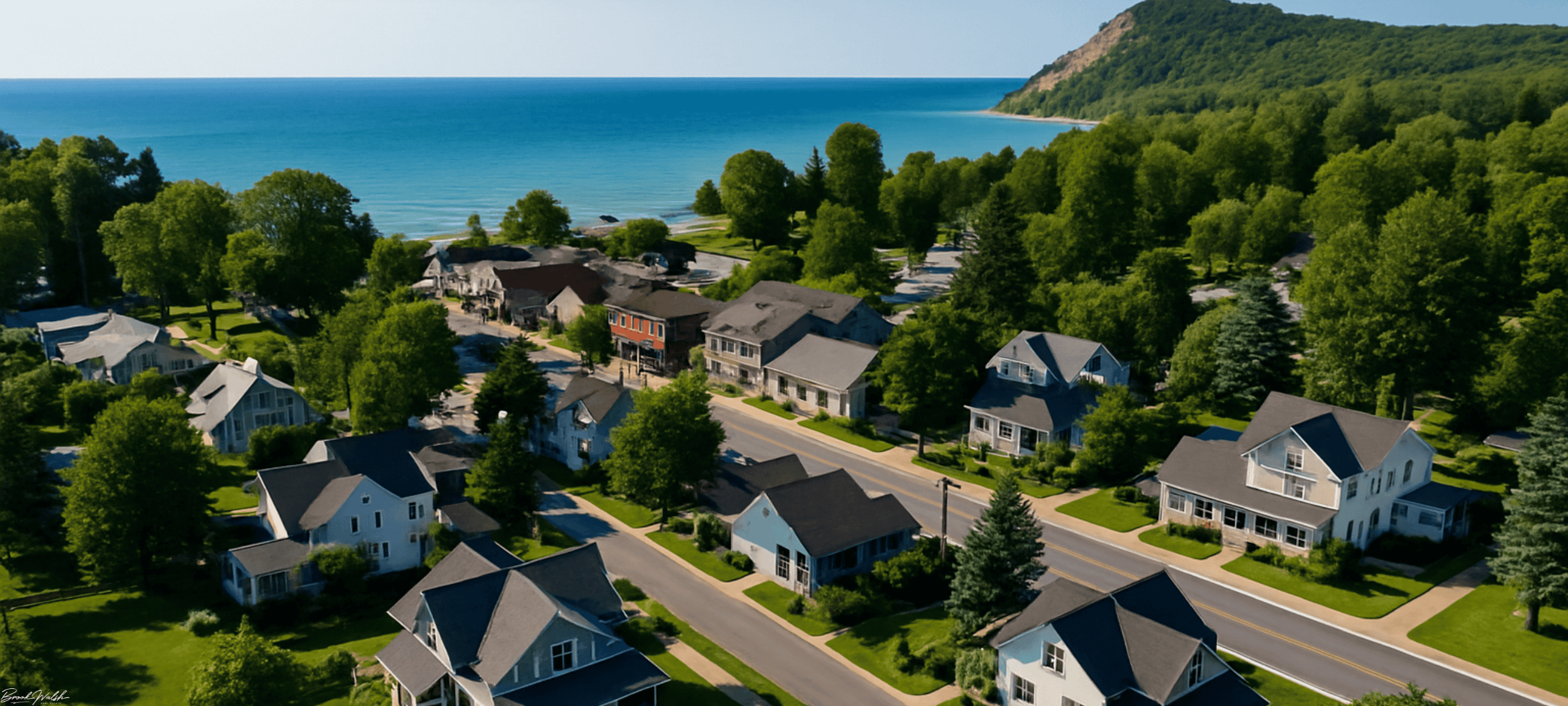 Aerial view of downtown Empire, MI with homes near Lake Michigan