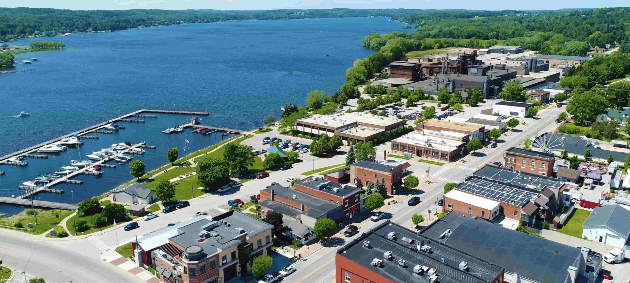 Scenic view of Downtown East Jordan with historic buildings, parks, and waterfront in the background