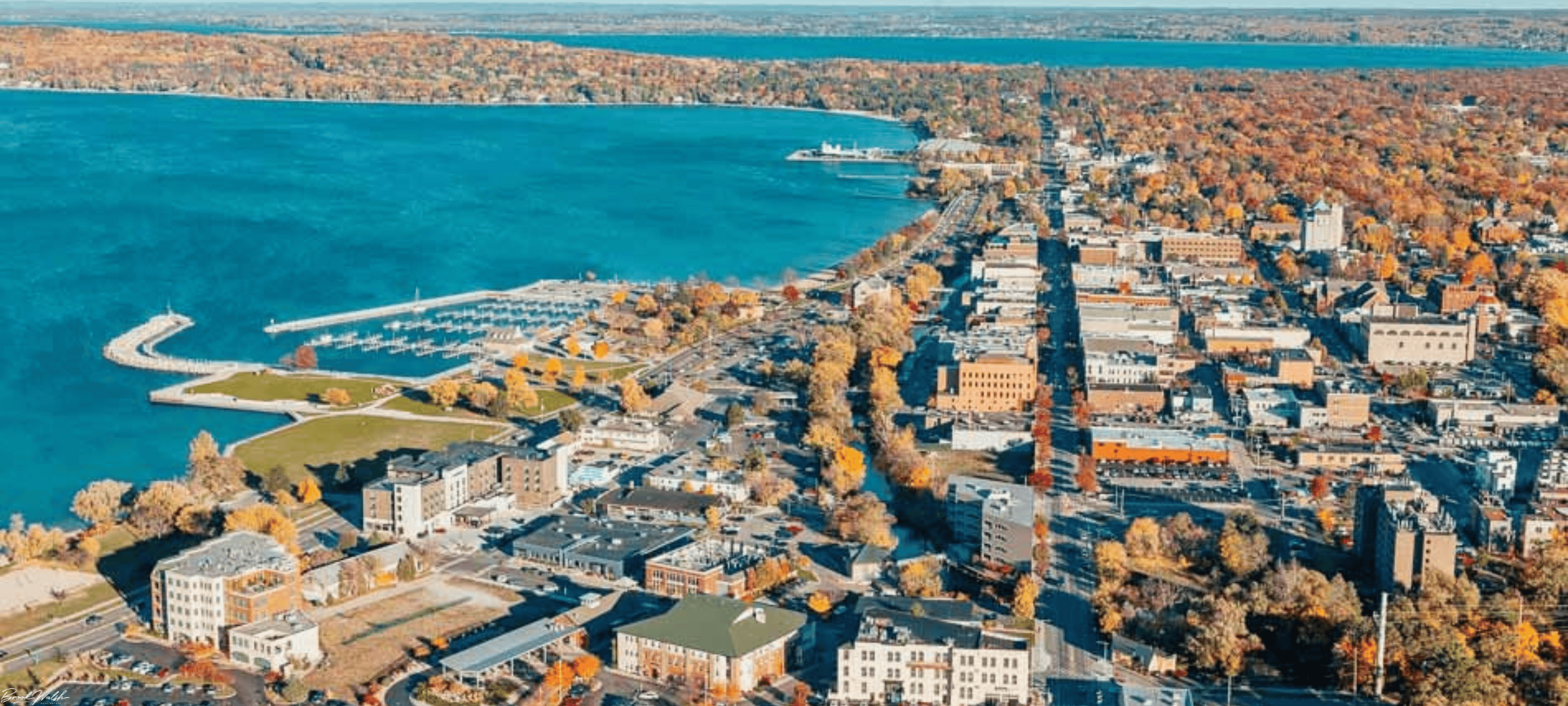 Scenic view of Downtown Traverse City with shops, cafes, and Grand Traverse Bay in the background
