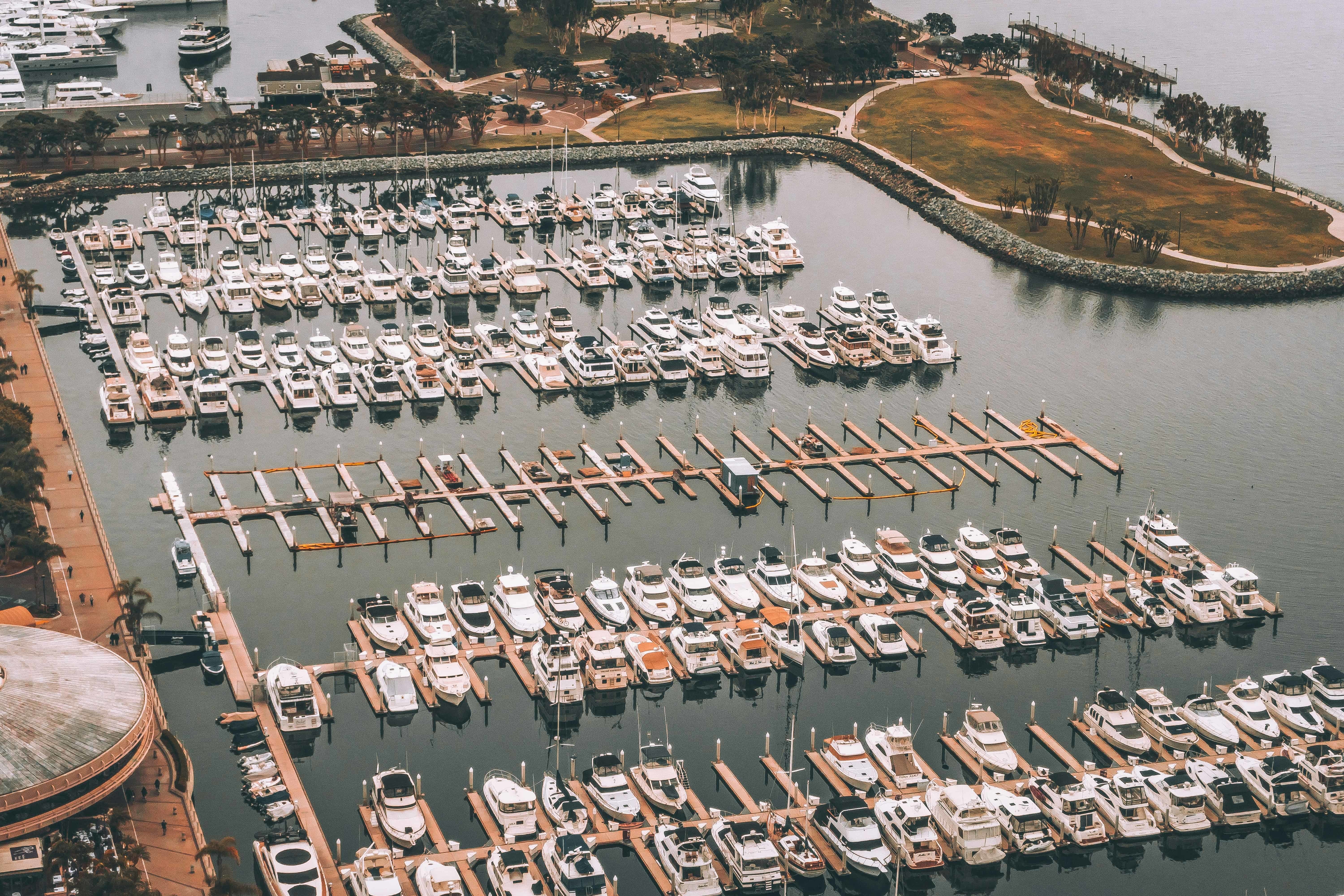 View of boats docked at Charlevoix Marina with Lake Charlevoix in the background.