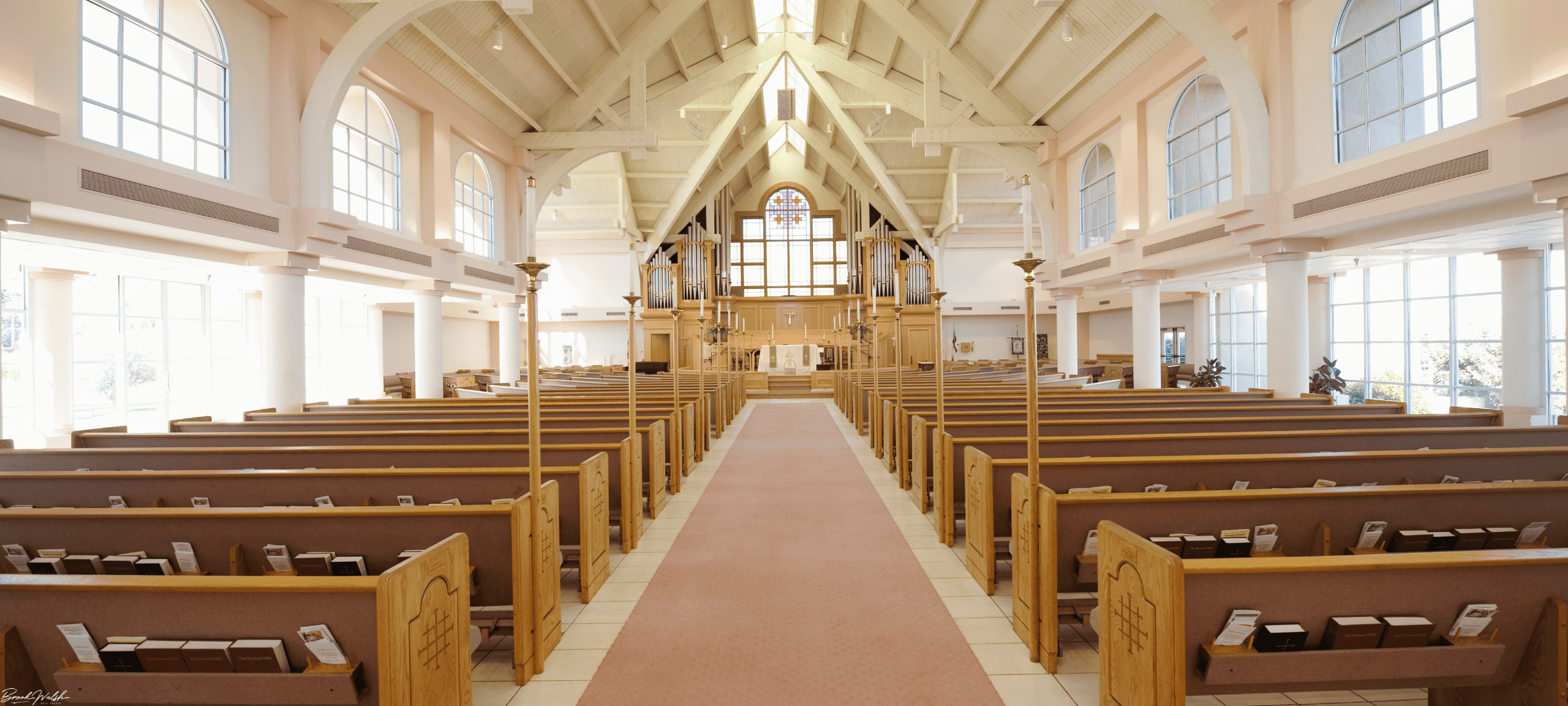 Exterior of Walloon Lake Community Church with scenic backdrop