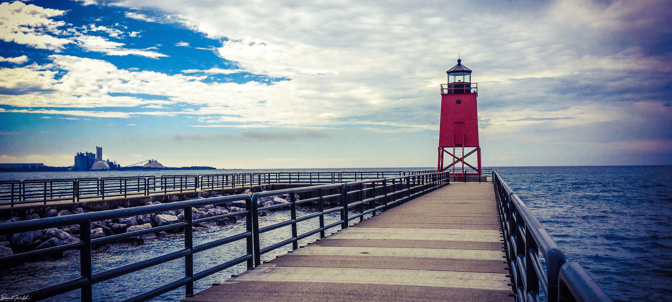 Scenic view of Lake Charlevoix Lighthouse at sunset