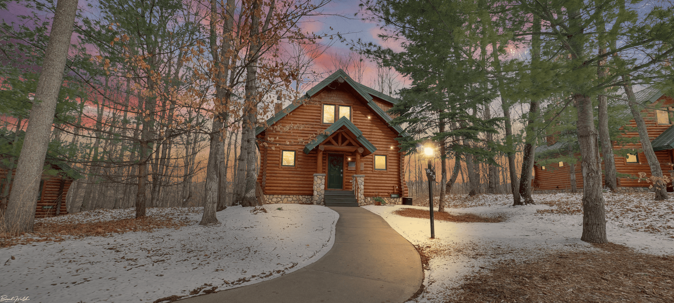 Rustic mountain cabin at Boyne Mountain surrounded by snow and trees