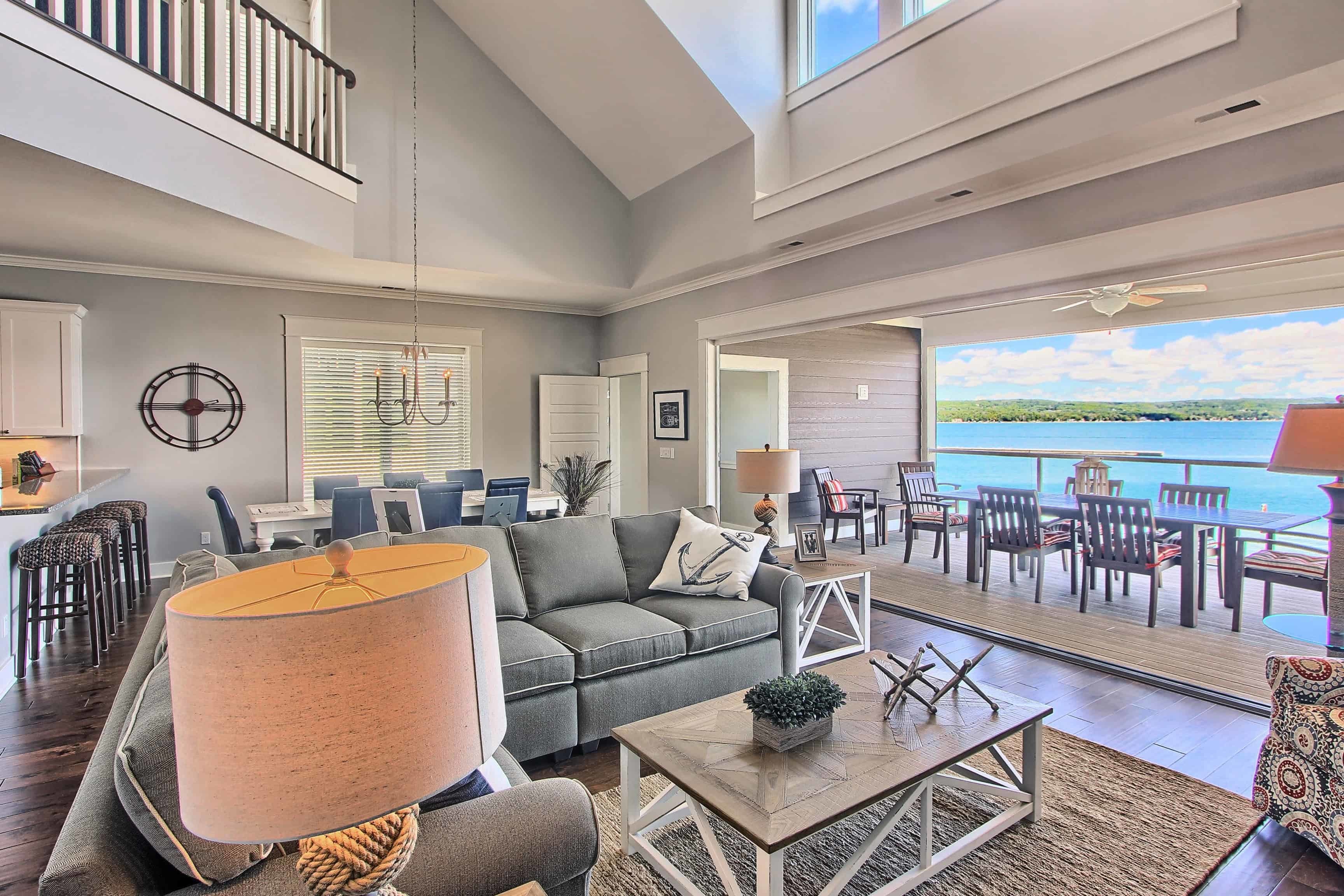 A view of Northern Michigan condominiums with lush greenery and a serene lake in the background.