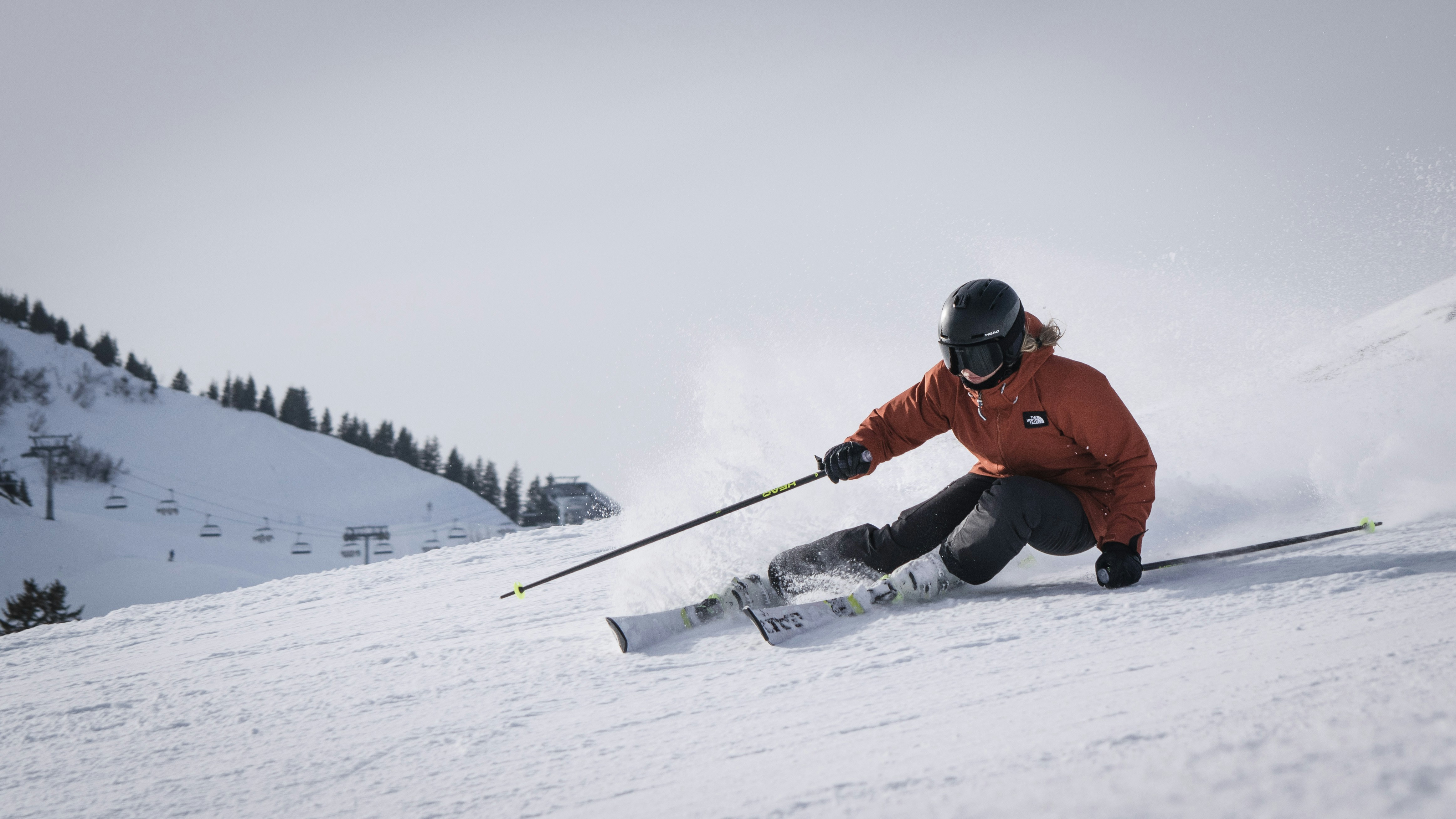 Skier enjoying a sunny day on the slopes at Nubs Knob, Harbor Springs, MI.