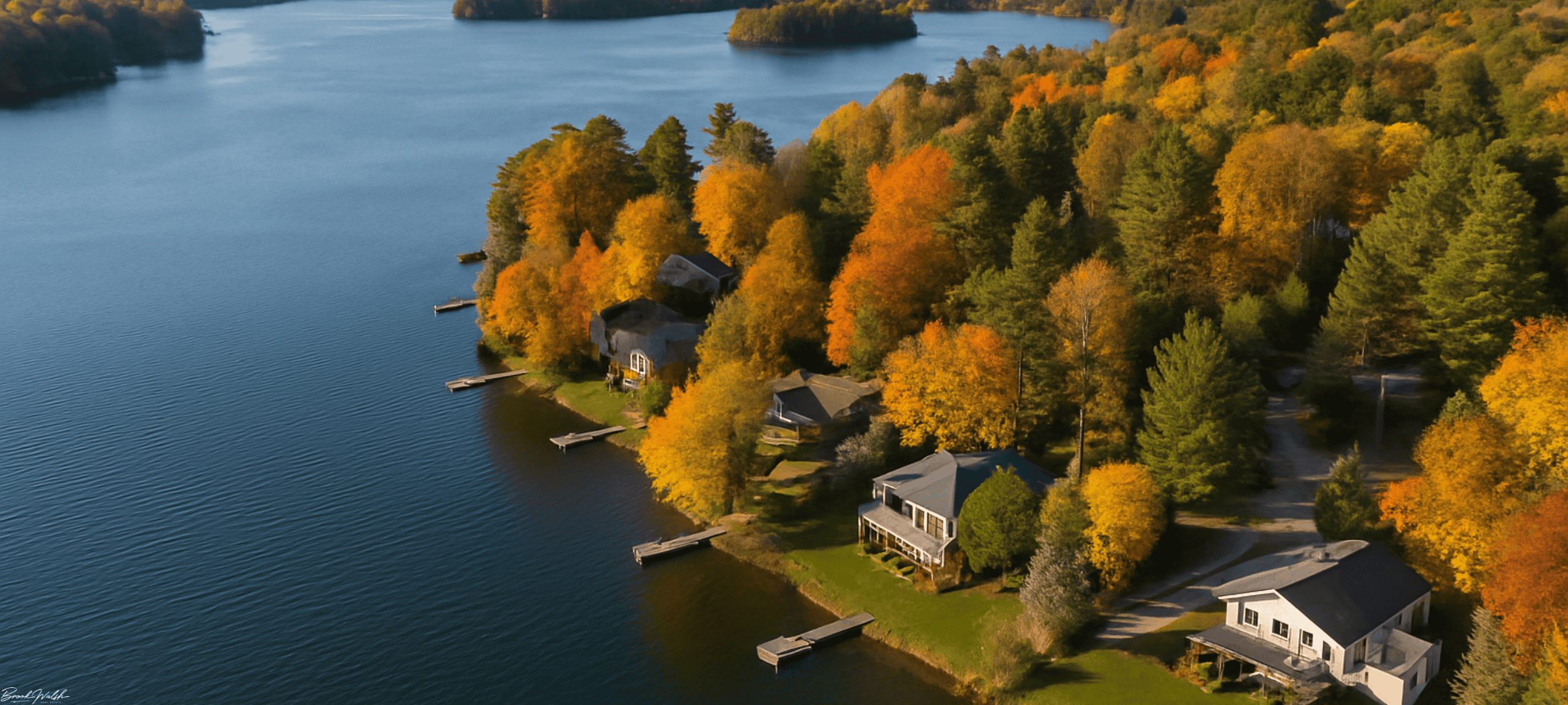 Aerial view of Spider Lake with waterfront homes in Traverse City