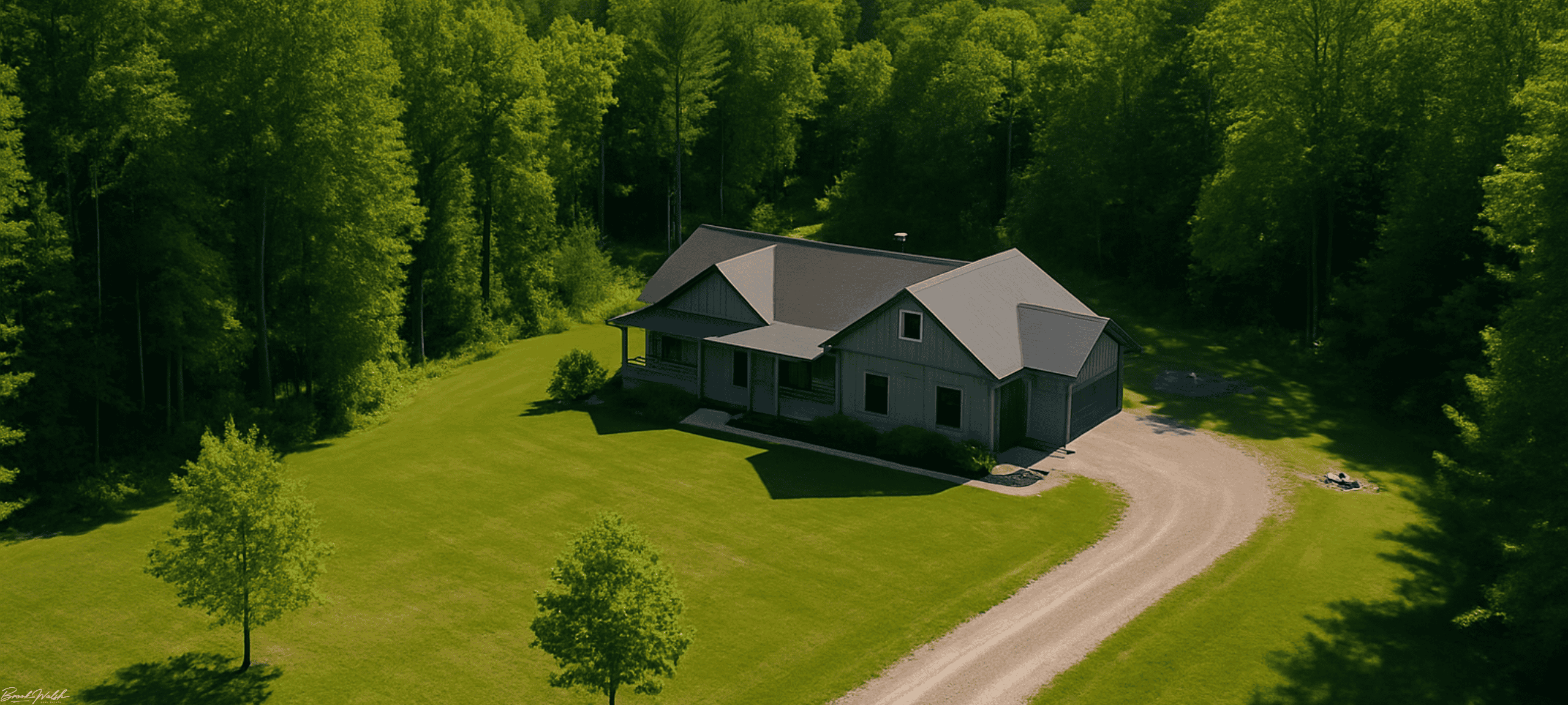 Aerial view of Thompsonville land lover home with wooded acreage