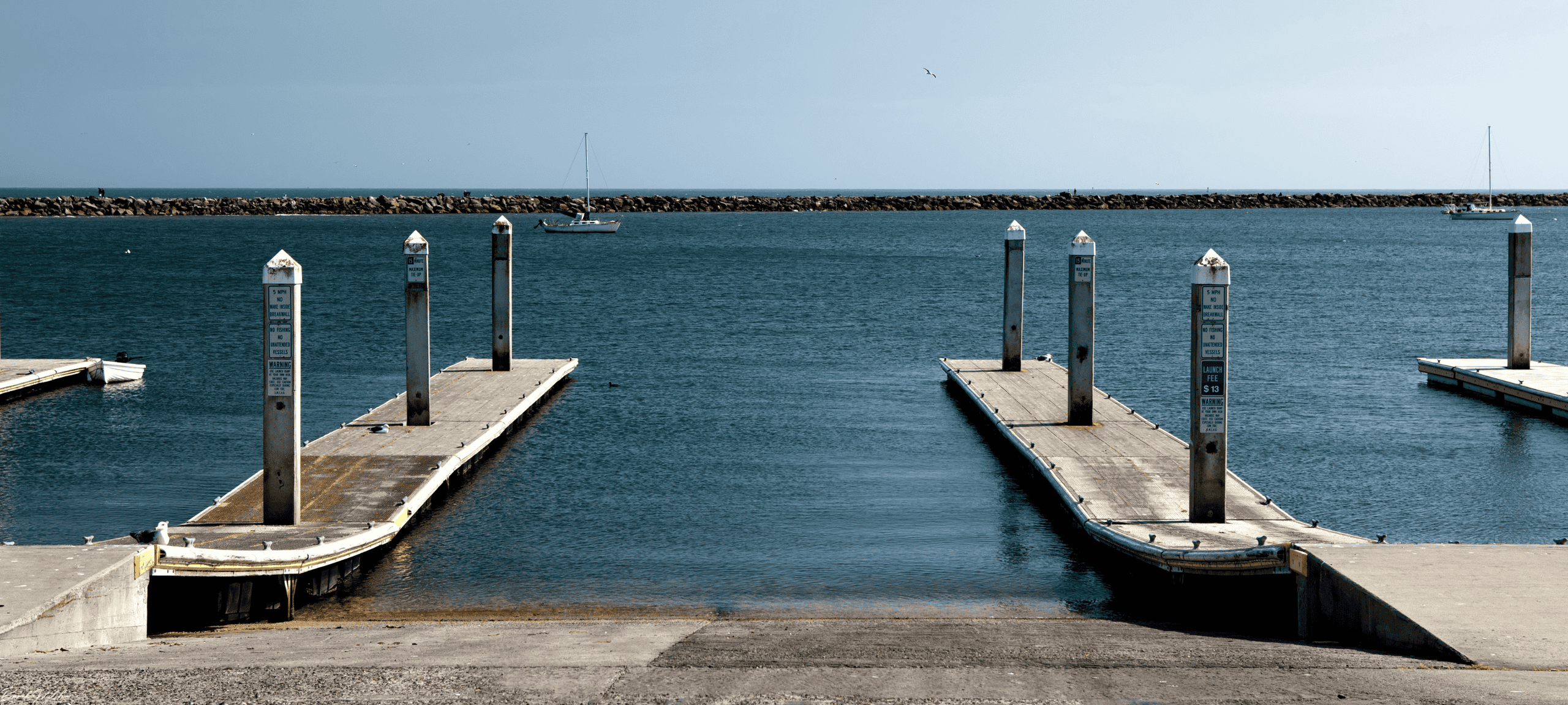 Aerial view of a boat ramp on Lake Charlevoix with boats launching