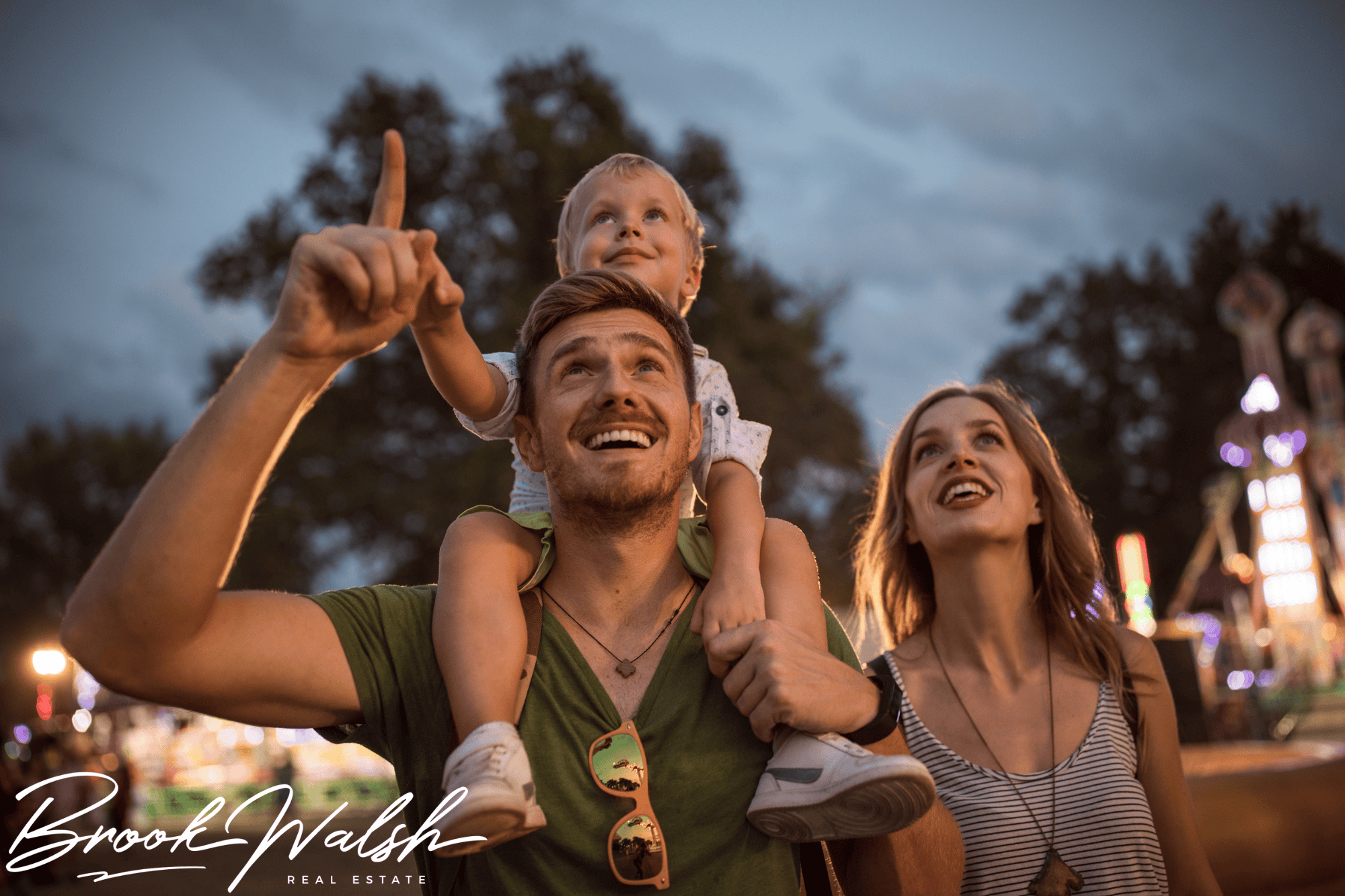Crowd enjoying a summer festival by the shore of Walloon Lake