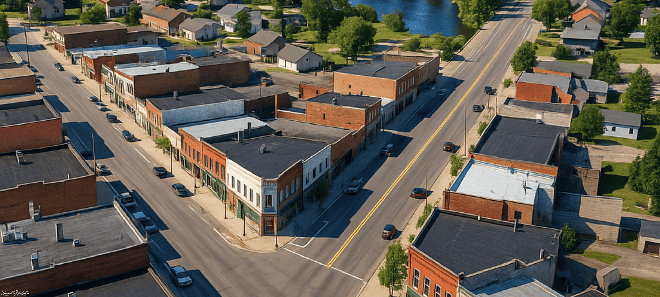 Aerial view of downtown Wolverine, MI with commercial buildings along a main street